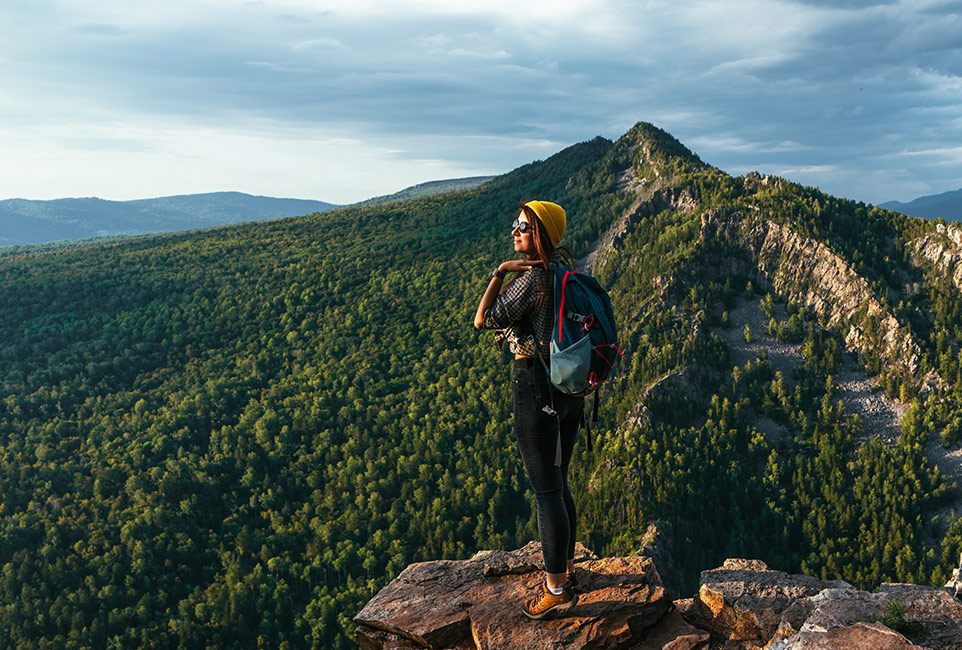 a-woman-with-a-backpack-travels-through-the-pictur-2U5ACQ6